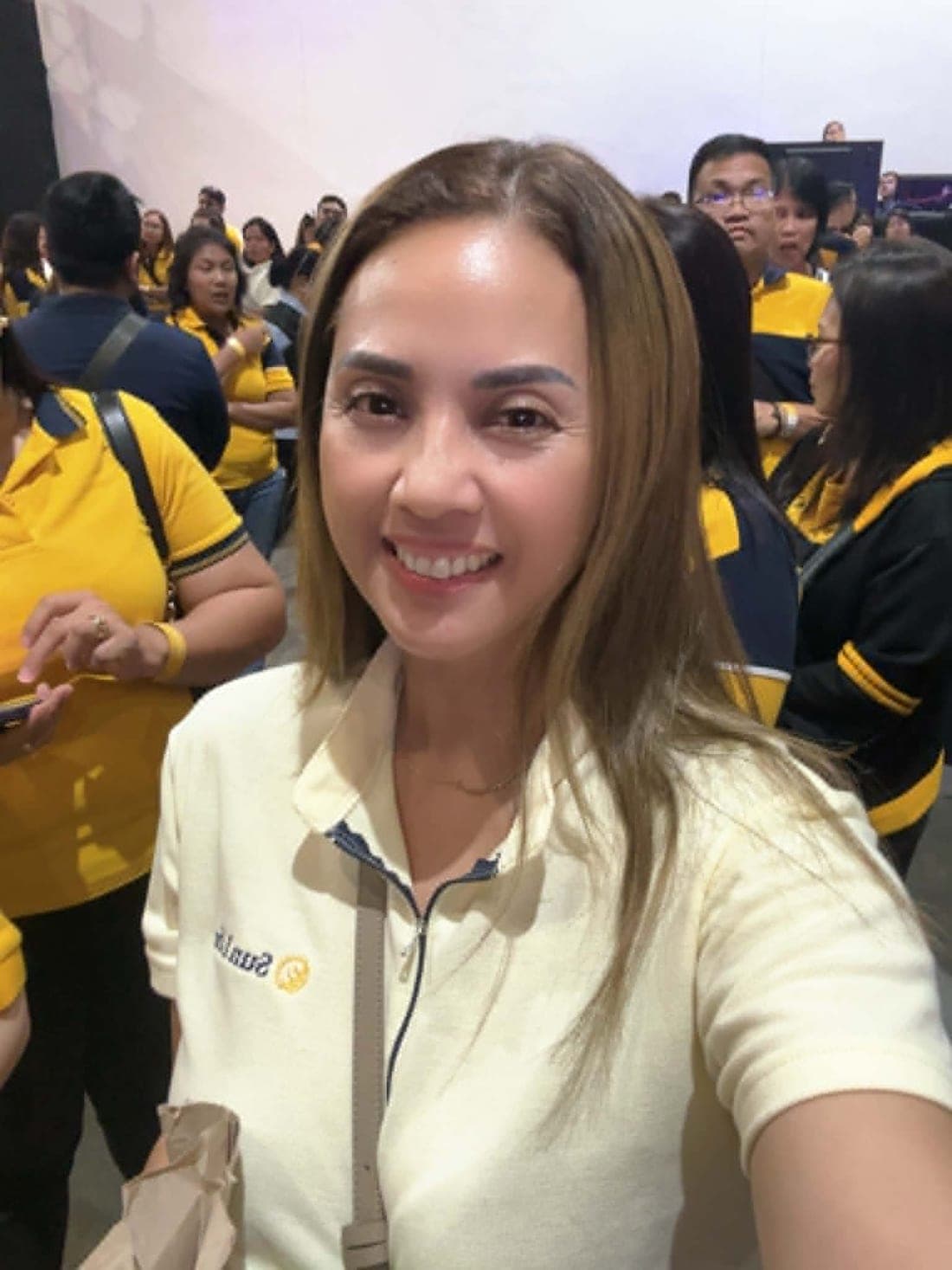 Ruth Abestilla, financial advisor with Sun Life Philippines, smiling at a company event